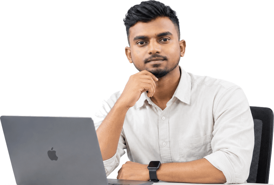 Abdul Kaiyum Sani at his desk with a laptop